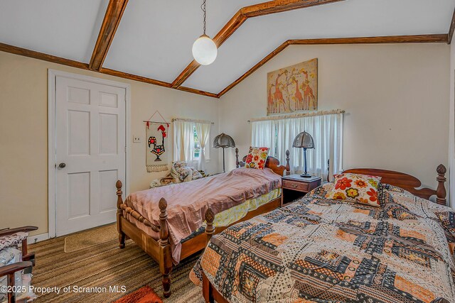 bedroom featuring high vaulted ceiling and carpet