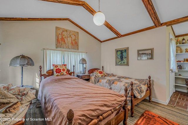 bedroom with vaulted ceiling and baseboards