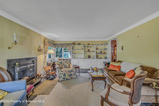living area with crown molding and wooden walls