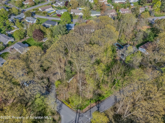 aerial view of property's location with nearby suburban area