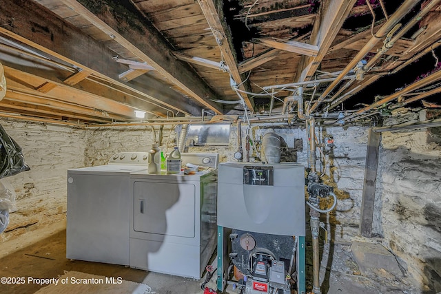 unfinished basement featuring independent washer and dryer
