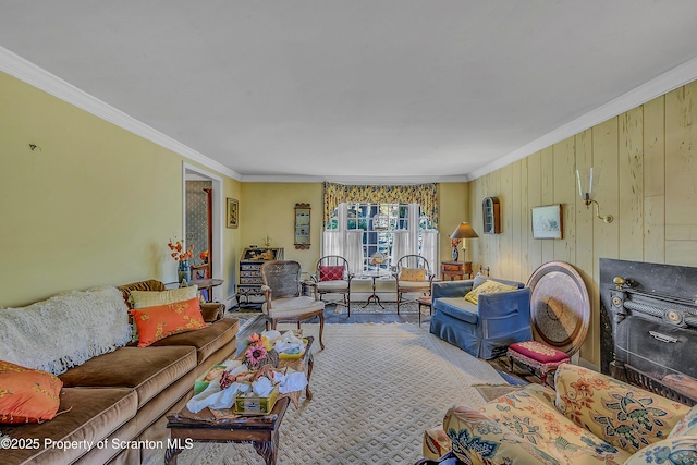 living room featuring ornamental molding and wood finished floors