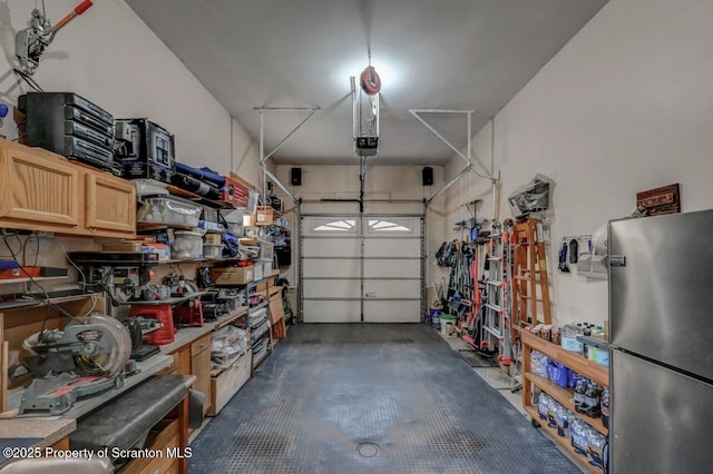 37 S Lehigh River Dr, Clifton Twp, PA 18424 - garage featuring freestanding refrigerator and a garage door opener