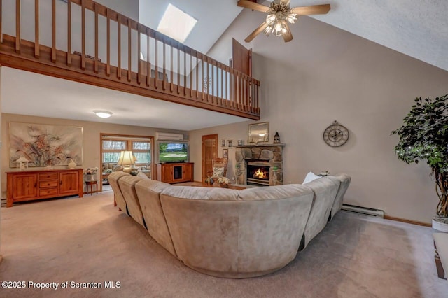 37 S Lehigh River Dr, Clifton Twp, PA 18424 - living room with carpet flooring, a ceiling fan, a stone fireplace, baseboard heating, and high vaulted ceiling