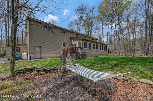 37 S Lehigh River Dr, Clifton Twp, PA 18424 - back of property featuring a wooden deck and a yard