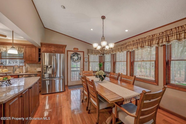 37 S Lehigh River Dr, Clifton Twp, PA 18424 - dining area featuring a chandelier, light wood finished floors, ornamental molding, lofted ceiling, and baseboards