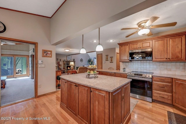 37 S Lehigh River Dr, Clifton Twp, PA 18424 - kitchen with appliances with stainless steel finishes, light wood-style floors, a center island, brown cabinets, and ornamental molding