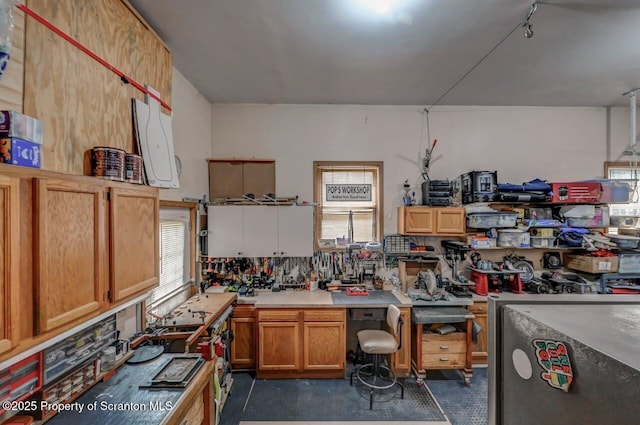 37 S Lehigh River Dr, Clifton Twp, PA 18424 - kitchen featuring plenty of natural light, light countertops, and brown cabinets