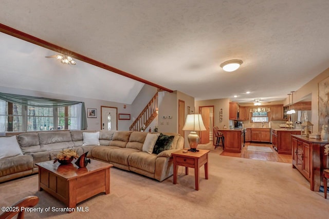 37 S Lehigh River Dr, Clifton Twp, PA 18424 - living room featuring ceiling fan, plenty of natural light, stairway, a textured ceiling, and lofted ceiling