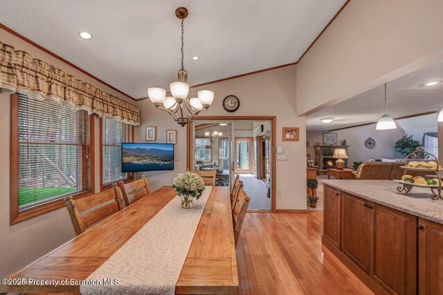 37 S Lehigh River Dr, Clifton Twp, PA 18424 - dining area featuring crown molding, a chandelier, light wood finished floors, plenty of natural light, and baseboards