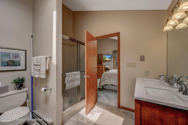 37 S Lehigh River Dr, Clifton Twp, PA 18424 - ensuite bathroom featuring a baseboard radiator, a stall shower, vanity, toilet, and baseboards