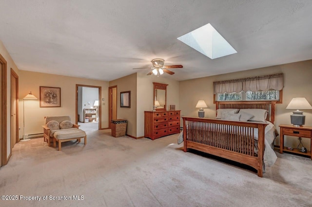 37 S Lehigh River Dr, Clifton Twp, PA 18424 - bedroom featuring a skylight, carpet floors, baseboard heating, a ceiling fan, and baseboards
