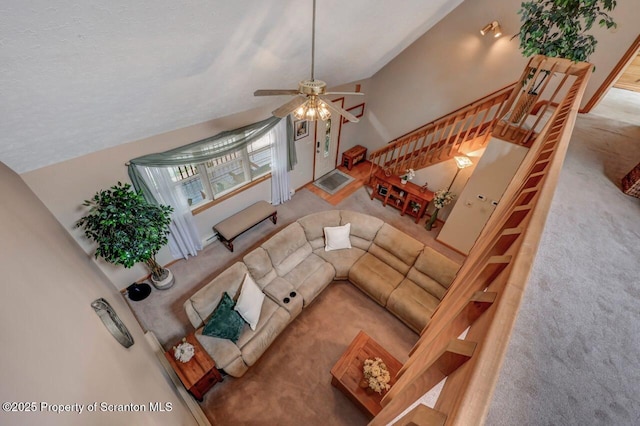 37 S Lehigh River Dr, Clifton Twp, PA 18424 - carpeted living room with a ceiling fan, lofted ceiling, and stairway