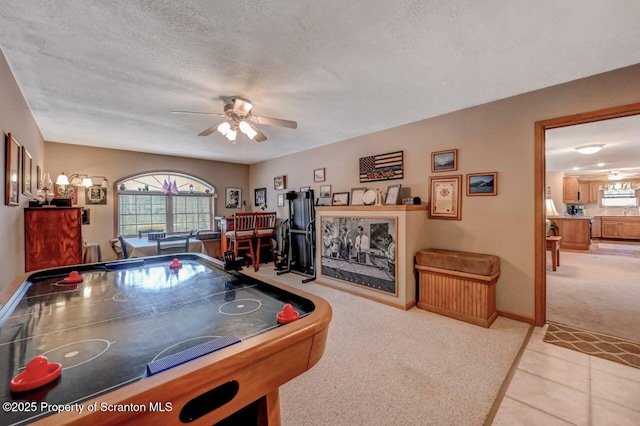 37 S Lehigh River Dr, Clifton Twp, PA 18424 - game room featuring a ceiling fan, carpet floors, a textured ceiling, baseboards, and tile patterned flooring