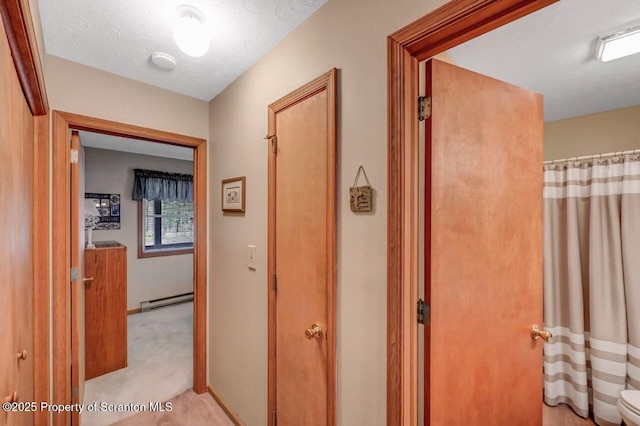 37 S Lehigh River Dr, Clifton Twp, PA 18424 - hallway with baseboard heating, carpet floors, and baseboards