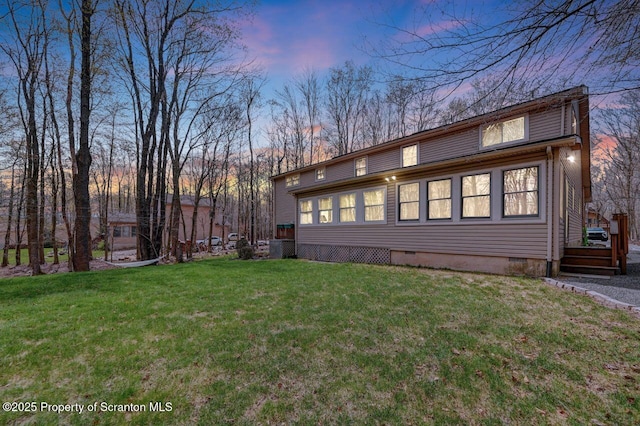 37 S Lehigh River Dr, Clifton Twp, PA 18424 - back of house at dusk featuring crawl space and a yard