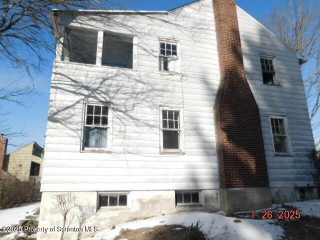 view of snow covered property