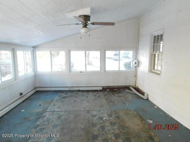 unfurnished sunroom featuring lofted ceiling, a healthy amount of sunlight, and ceiling fan