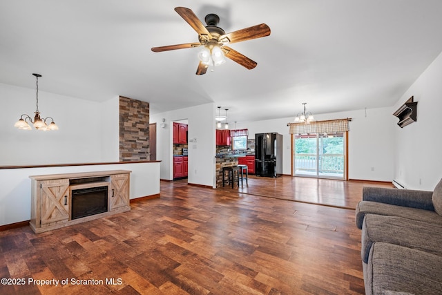 609 Landmesser Ave, West Hazleton, PA 18202 - living area featuring a chandelier, dark wood-style flooring, ceiling fan, and a fireplace