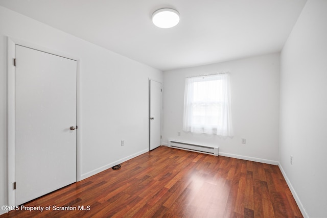 609 Landmesser Ave, West Hazleton, PA 18202 - unfurnished bedroom featuring a baseboard radiator and wood finished floors