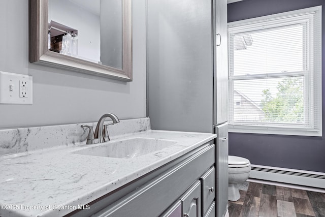 609 Landmesser Ave, West Hazleton, PA 18202 - bathroom with a baseboard radiator, wood finished floors, and vanity