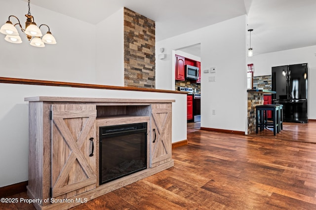 609 Landmesser Ave, West Hazleton, PA 18202 - living room featuring a chandelier, wood finished floors, and a fireplace
