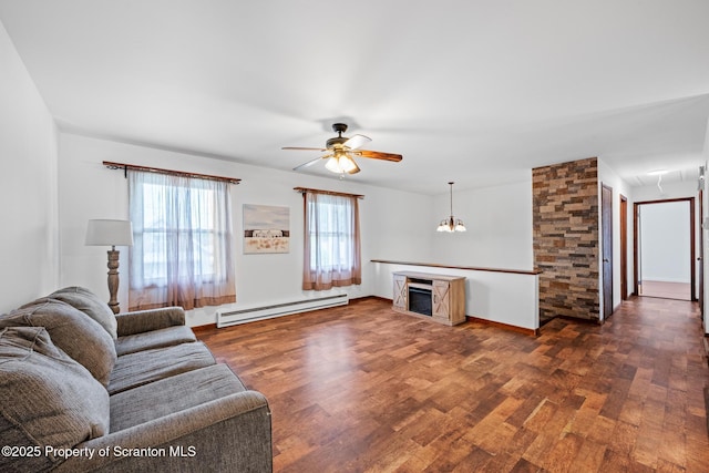 609 Landmesser Ave, West Hazleton, PA 18202 - living room with a baseboard heating unit, dark wood finished floors, ceiling fan, and a chandelier