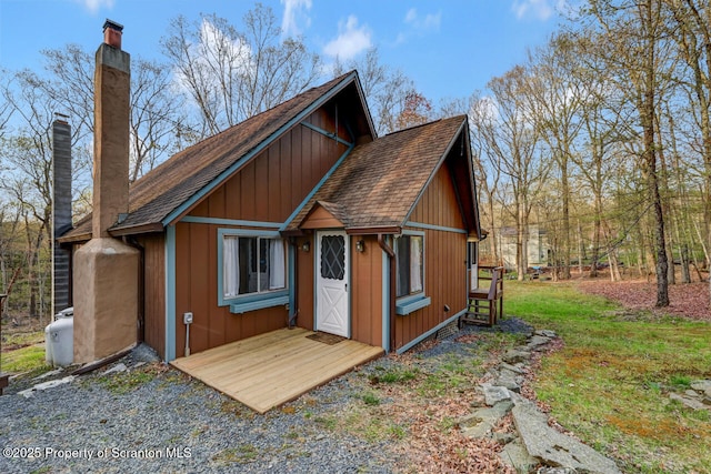 3222 Bluebird Dr, Bushkill, PA 18324 - rear view of house with a chimney and a shingled roof