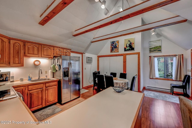 3222 Bluebird Dr, Bushkill, PA 18324 - kitchen with a sink, brown cabinetry, wood finished floors, stainless steel fridge, and light countertops