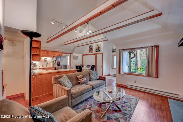 3222 Bluebird Dr, Bushkill, PA 18324 - living area featuring light wood-type flooring, lofted ceiling, baseboard heating, and ceiling fan