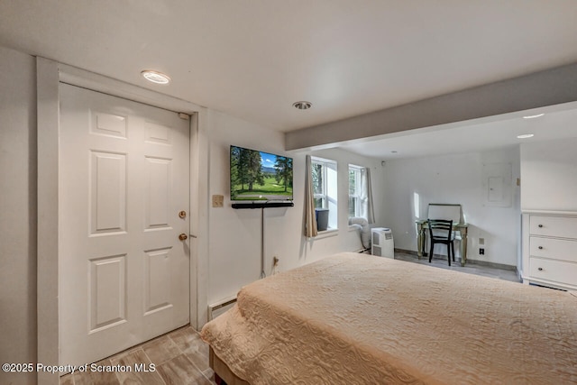 3222 Bluebird Dr, Bushkill, PA 18324 - bedroom featuring baseboard heating and light wood-style flooring
