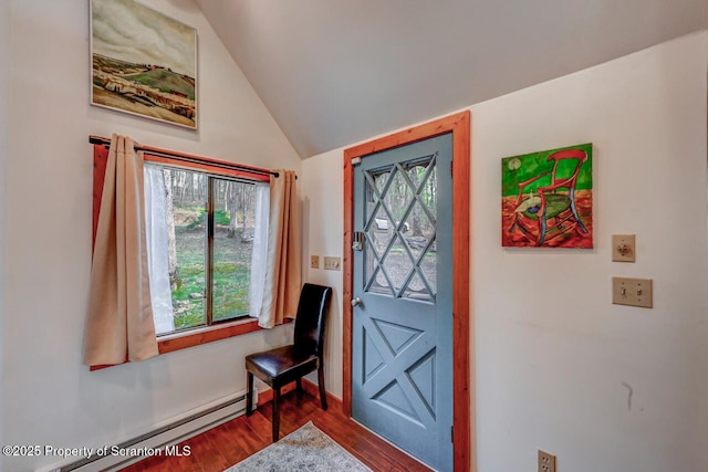 3222 Bluebird Dr, Bushkill, PA 18324 - entrance foyer with vaulted ceiling, wood finished floors, and a baseboard heating unit