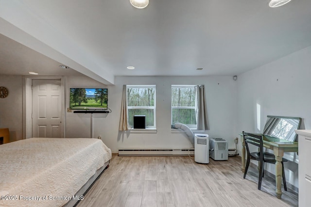 3222 Bluebird Dr, Bushkill, PA 18324 - bedroom with baseboard heating, recessed lighting, and wood finished floors