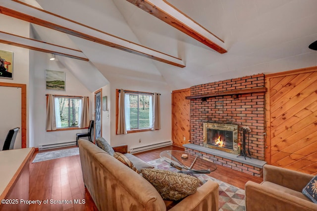 3222 Bluebird Dr, Bushkill, PA 18324 - living area featuring a fireplace, wood finished floors, lofted ceiling with beams, and a baseboard heating unit