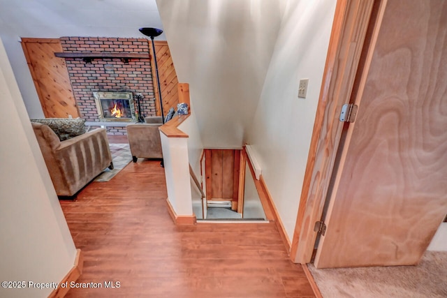 3222 Bluebird Dr, Bushkill, PA 18324 - hallway featuring baseboards, an upstairs landing, and wood finished floors