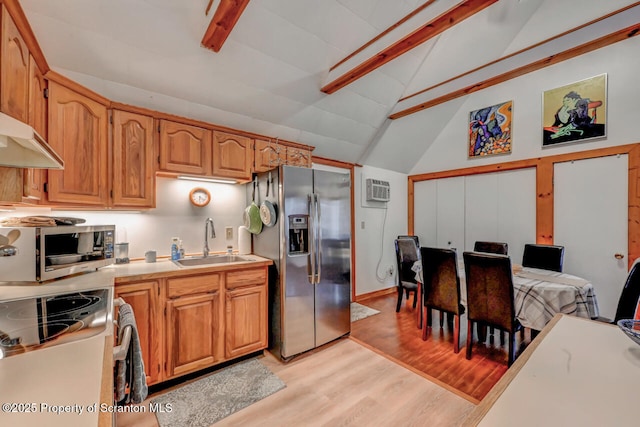 3222 Bluebird Dr, Bushkill, PA 18324 - kitchen with light wood-style flooring, a sink, stainless steel appliances, beamed ceiling, and light countertops