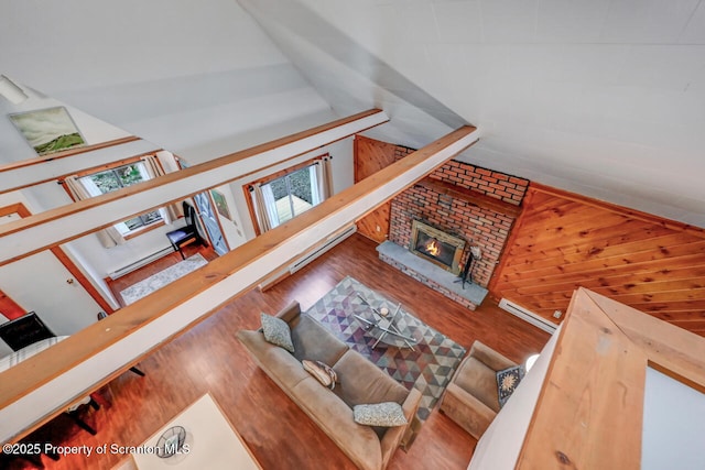 3222 Bluebird Dr, Bushkill, PA 18324 - living room with a fireplace, plenty of natural light, and wood finished floors