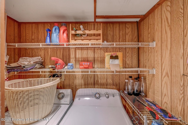 3222 Bluebird Dr, Bushkill, PA 18324 - laundry area with washing machine and clothes dryer, laundry area, and wooden walls