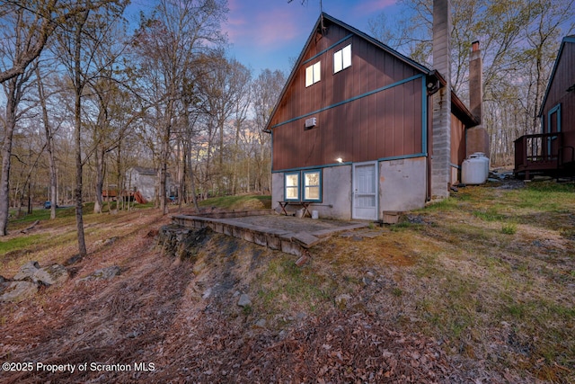 3222 Bluebird Dr, Bushkill, PA 18324 - property exterior at dusk with a chimney
