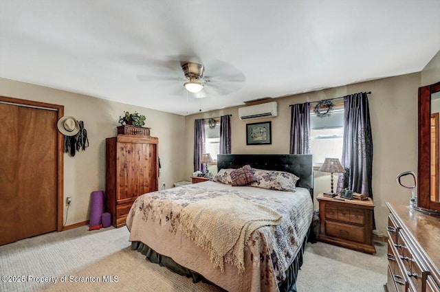 carpeted bedroom featuring ceiling fan, a wall mounted AC, and multiple windows