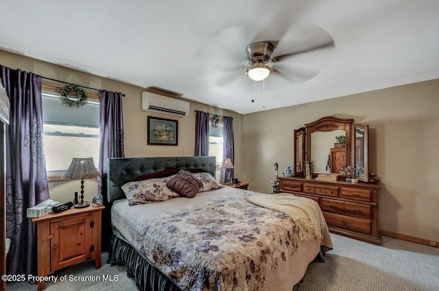 carpeted bedroom featuring an AC wall unit, multiple windows, and ceiling fan