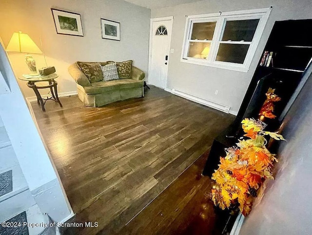 interior space featuring dark hardwood / wood-style flooring and baseboard heating