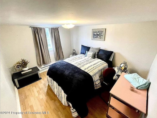 bedroom featuring hardwood / wood-style floors