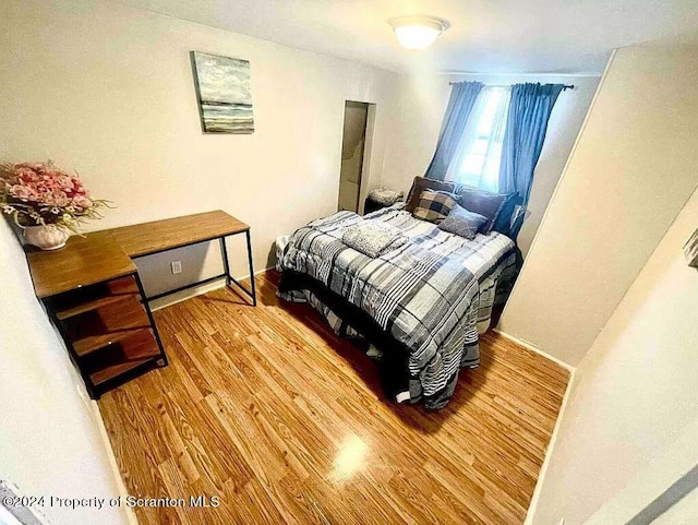 bedroom featuring hardwood / wood-style flooring