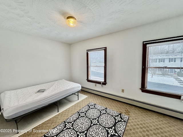 bedroom with a baseboard radiator