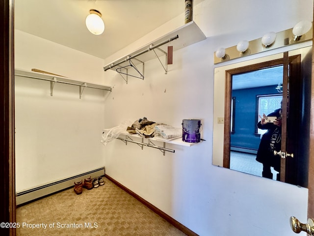 walk in closet featuring carpet and a baseboard radiator