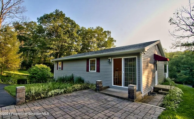 back of property featuring a patio area