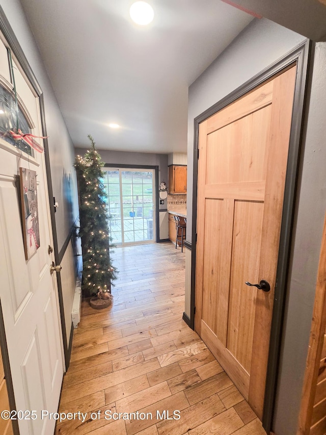 hallway featuring light hardwood / wood-style flooring