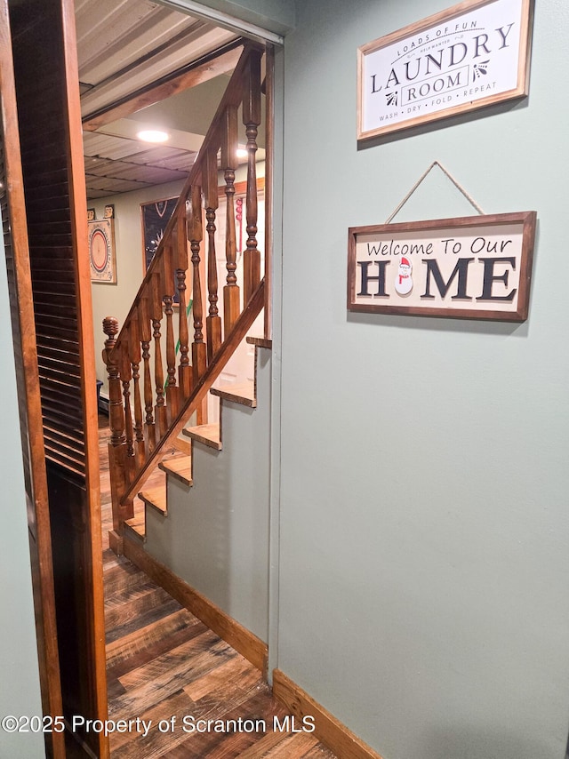 stairway featuring hardwood / wood-style flooring