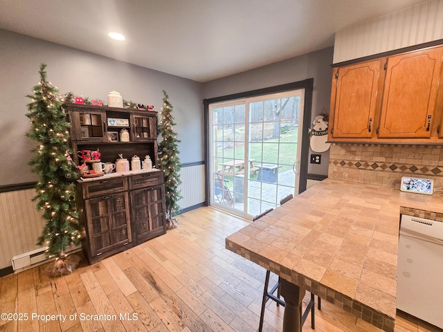 interior space with light hardwood / wood-style floors and baseboard heating